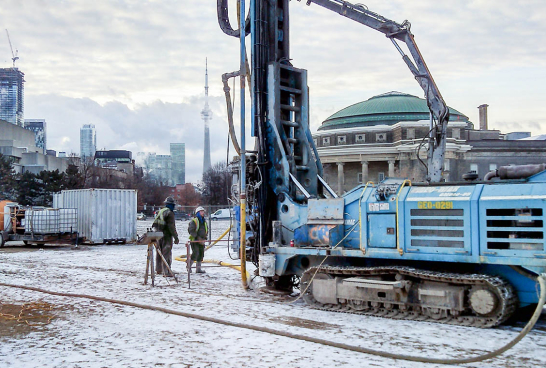 View of front campus with landmark project construction underway in winter