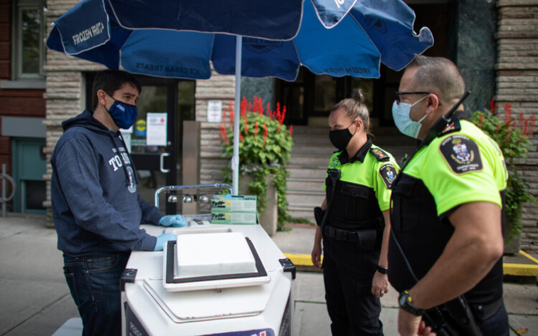 Ron Saporta, Chief Operating Officer, hands out ice cream, with the help of True Blue, during a Facilities & Services staff appreciation event.