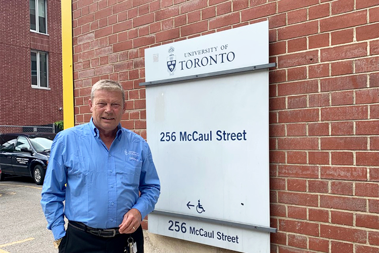 Ron Atkins stands outside of 256 McCaul St.