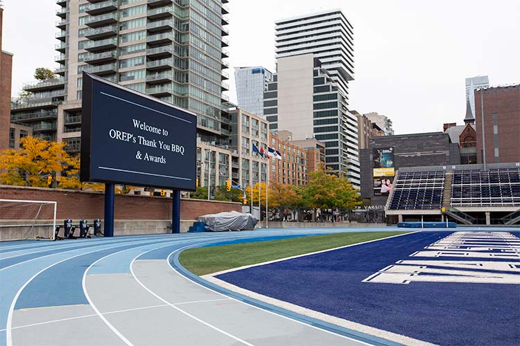 Varsity Stadium with a sign saying welcome to OREP's thank you BBQ and awards.