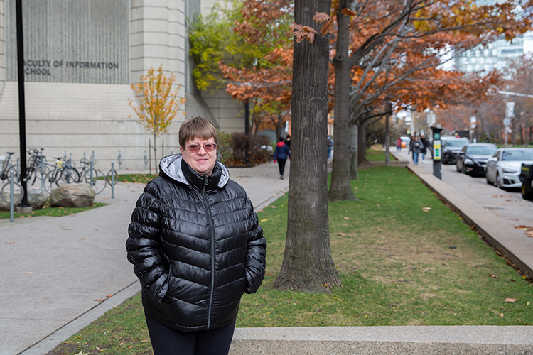 Lisette Henrich stands outside of Robarts Library.