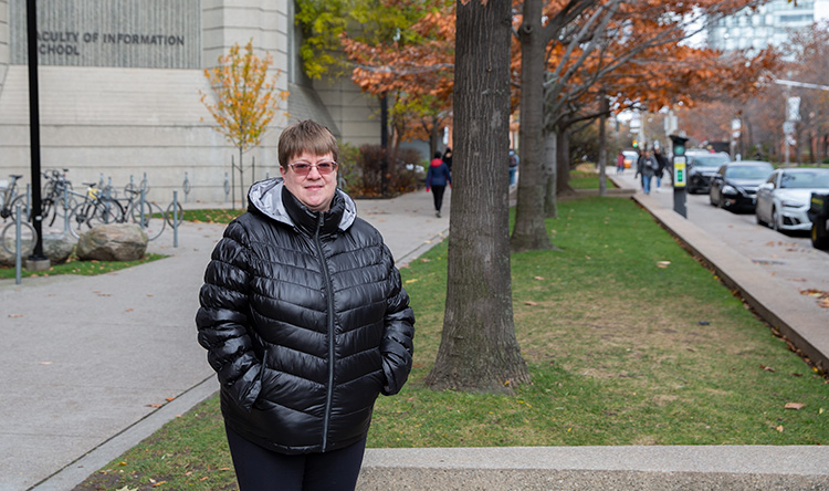 Lisette Henrich stands outside of Robarts Library.