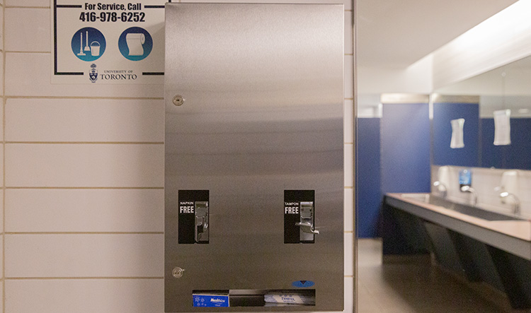 A dispenser for free menstrual products in a campus washroom.