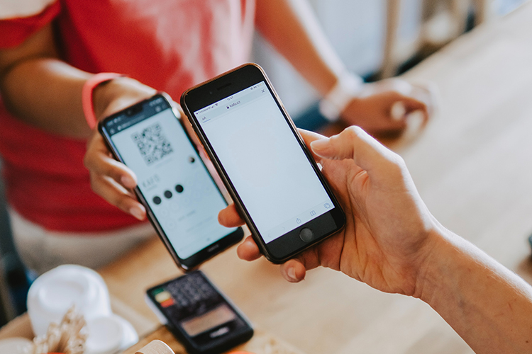 A person uses a photo to check in at an event.