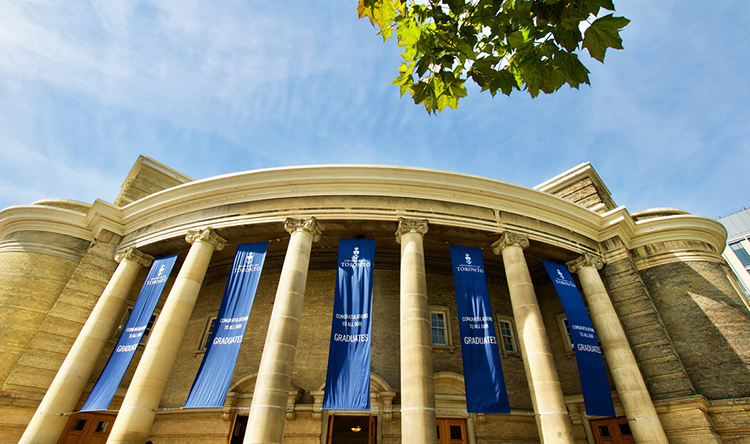 The outside of Convocation Hall decorated with banners for convocation.