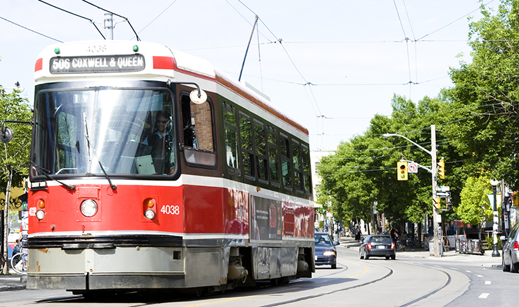 The 506 streetcar moves along the street.