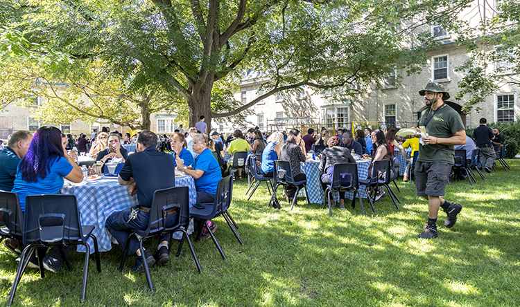 OREP staff eating food at the annual BBQ and awards ceremony.