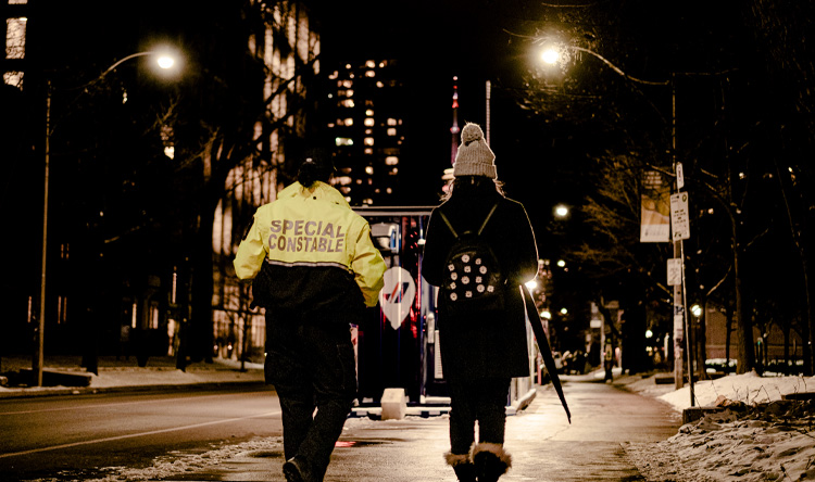 Special Constable Veronica Martins walks with a student