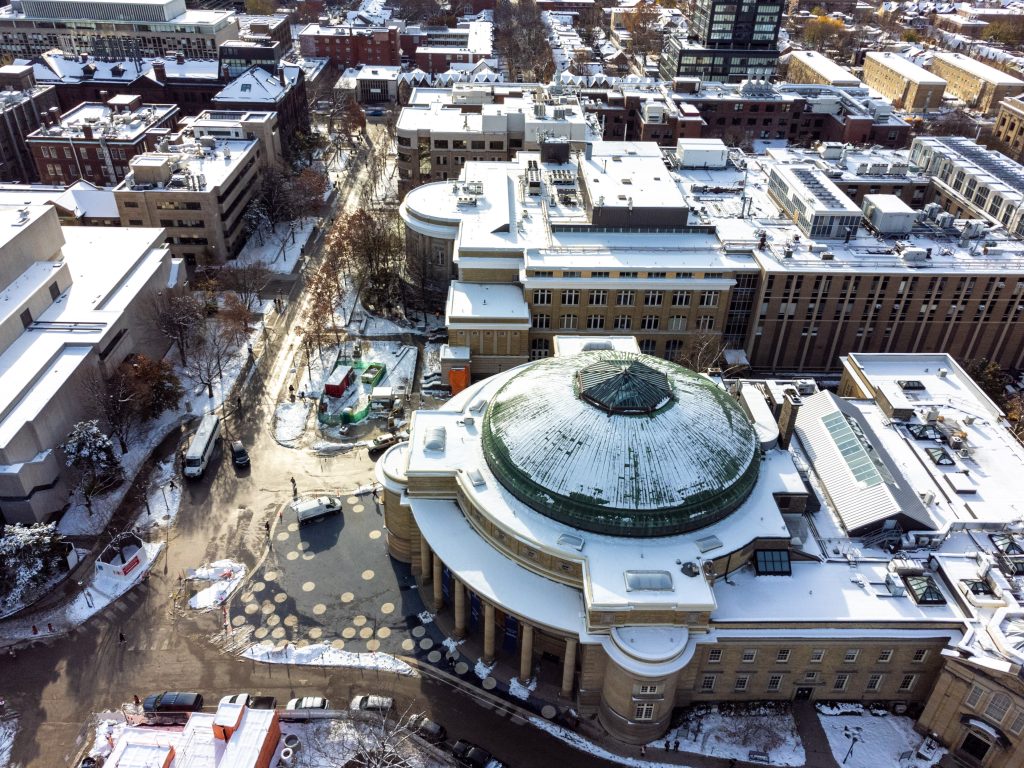 Aerial view of a snow covered Convocation Hall at St. George campus, University of Toronto.