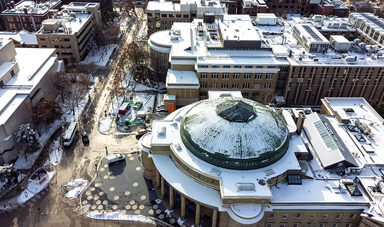 Aerial view of a snow covered Convocation Hall at St. George campus, University of Toronto.